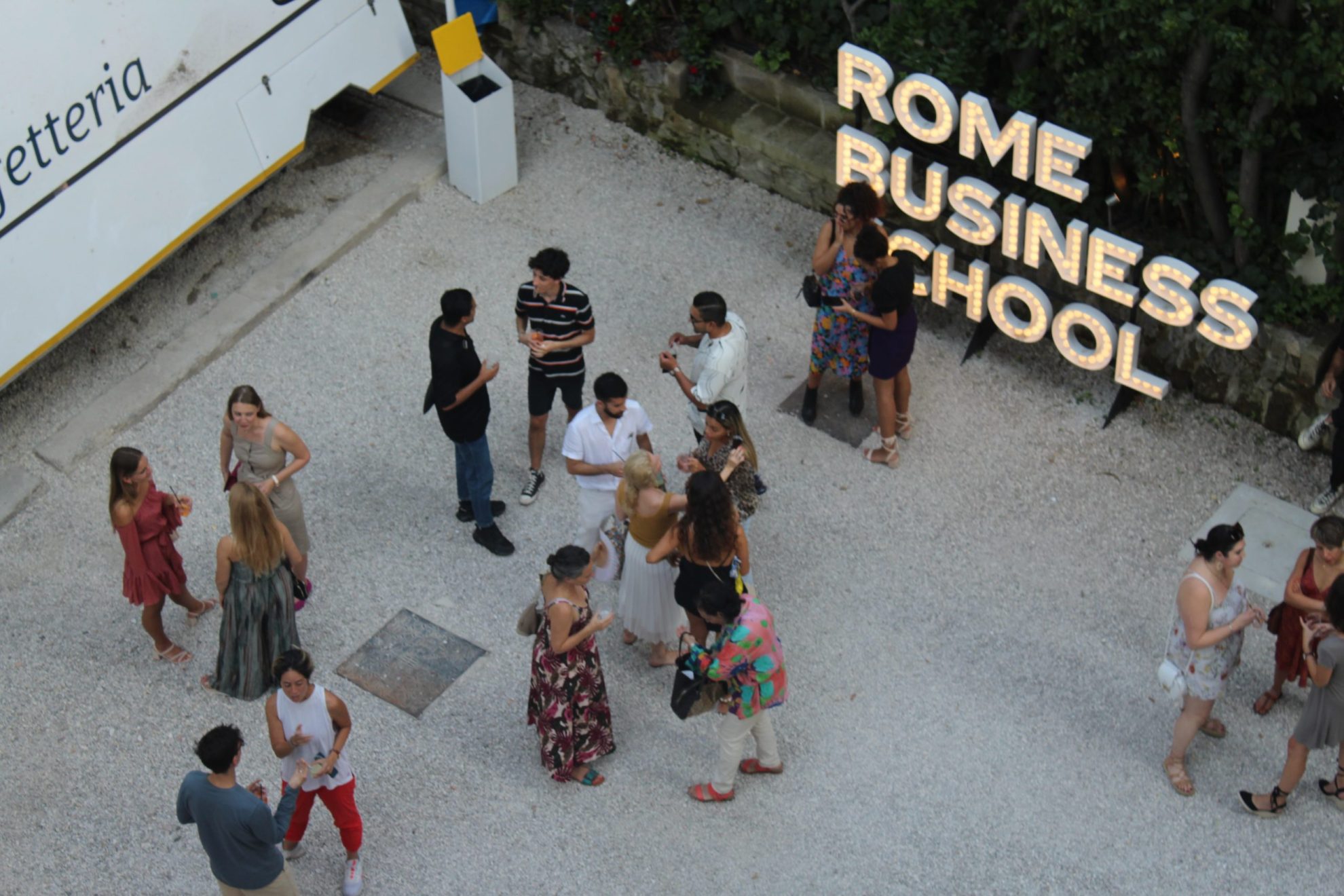 rome business school students networking in the garden