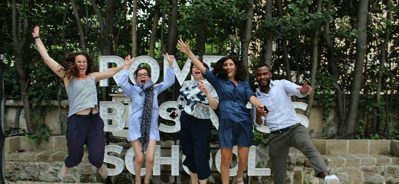 rome business school master students jumping up