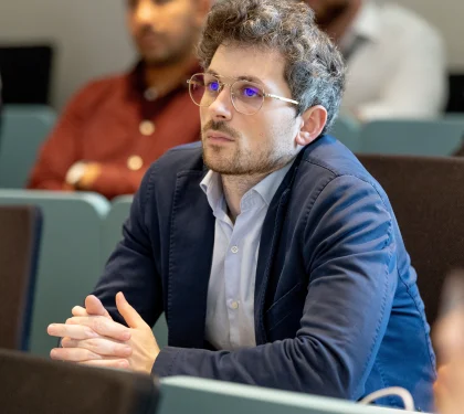 marketing master student listening on campus