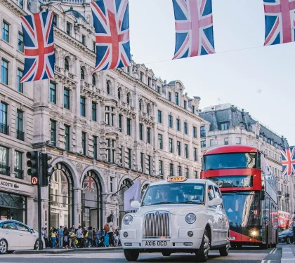 international bootcamp in London city with bus and flags